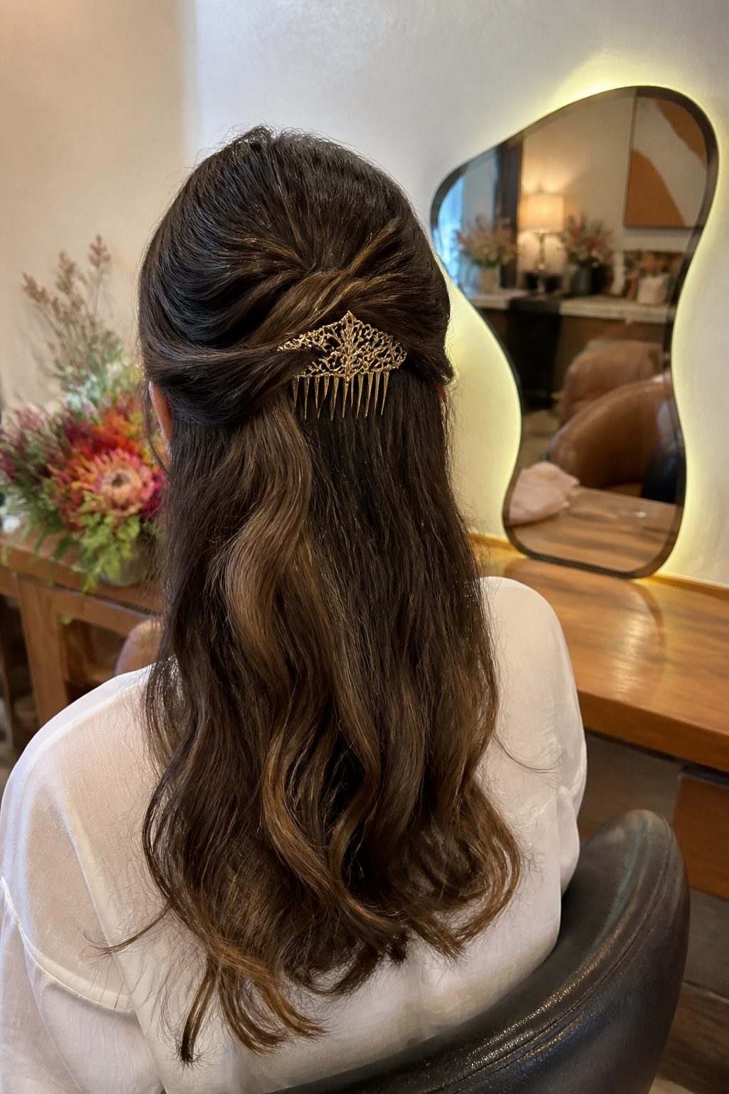 Headpiece Jewelry for Long Hairstyles in 2026 5 An ornate hair comb inserted into a glamorous updo of long hair.