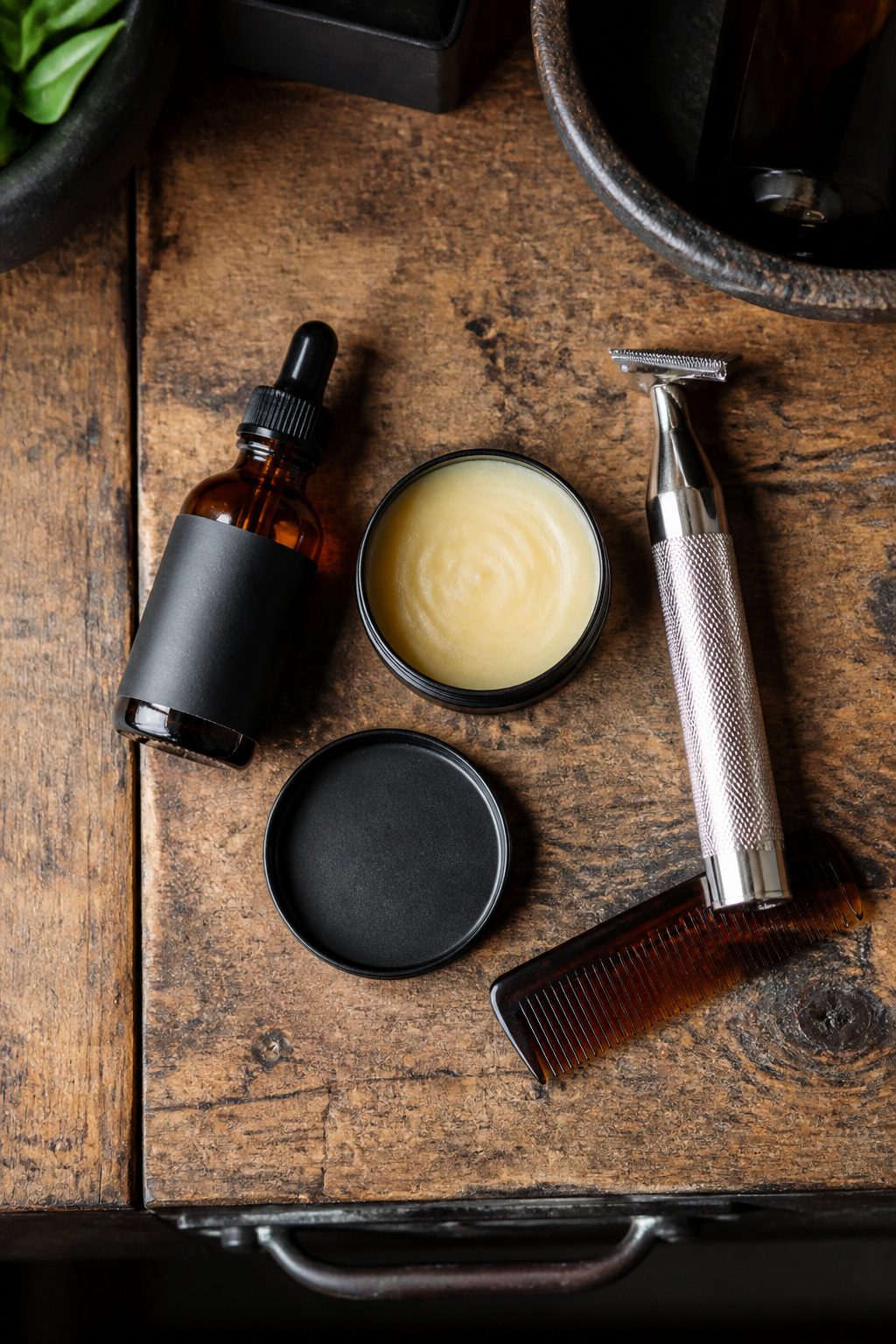 Grooming tools including mustache wax and beard oil.